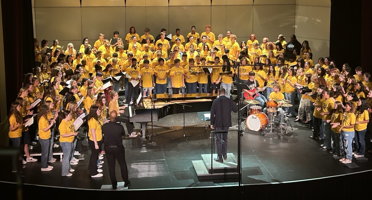 full choir performing on stage