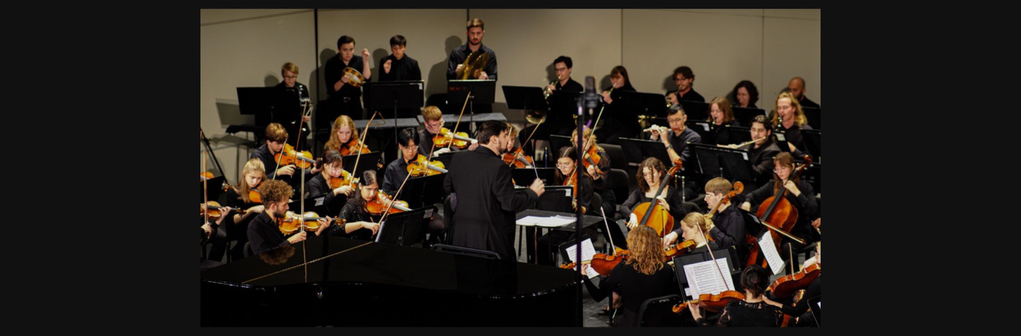 A photo of a Mizzou students playing instruments